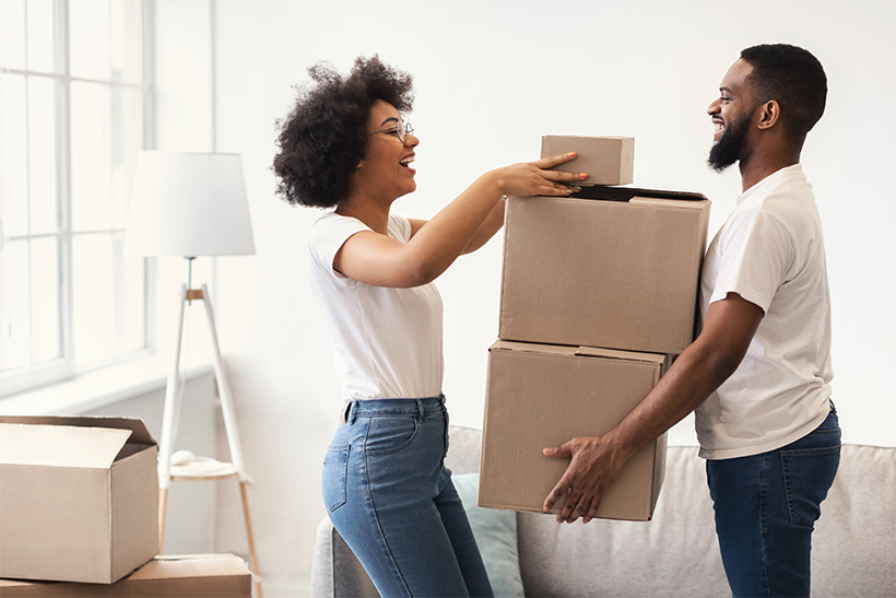 A couple is packing in a hurry