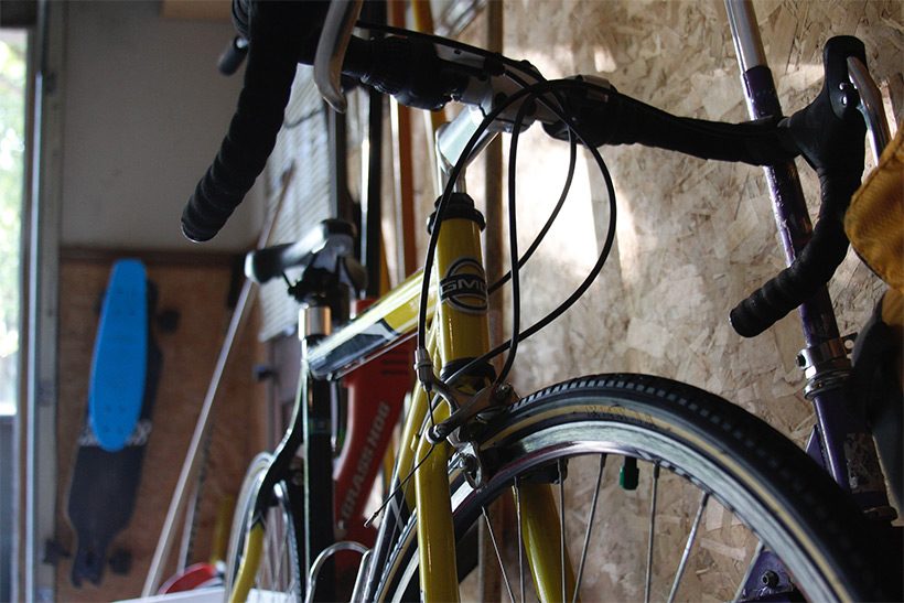 A road bike in a garage