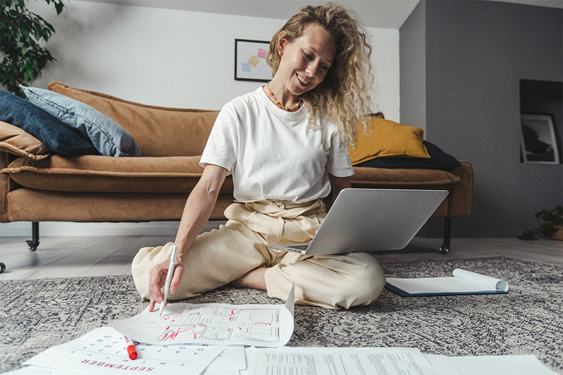 A Woman Is Creating A Floor Plan For A Moving