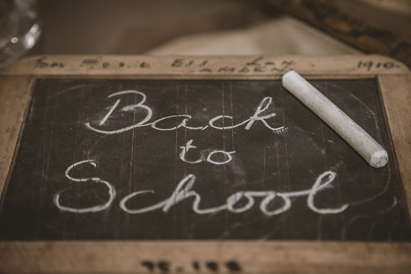 A Sentence Saying Back To School Written On A Mini Chalkboard
