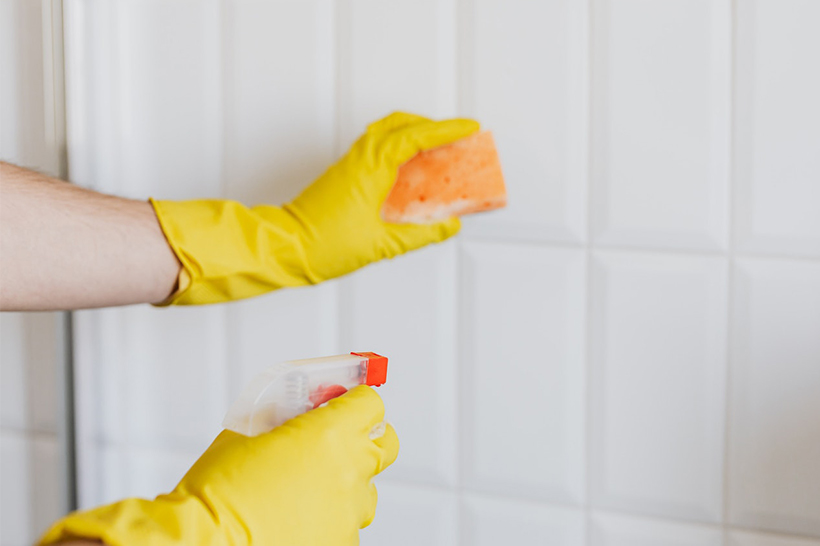 A Woman Is Cleaning Bathroom Tiles