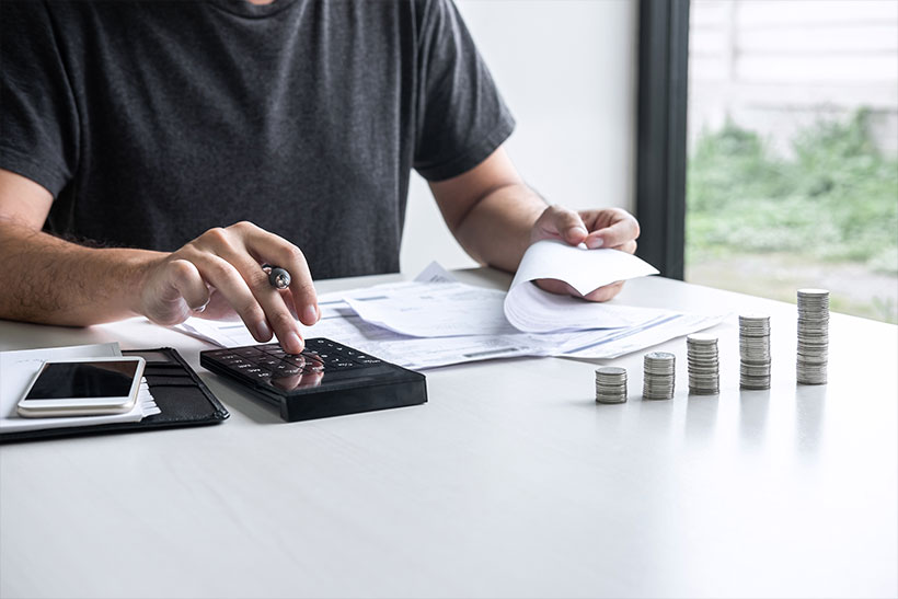 A Man Calculates Moving Costs