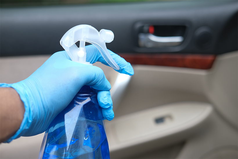 A Man Cleans A Car Interior