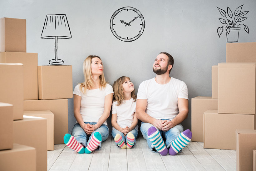 A Happy Family Waiting for Movers to Come