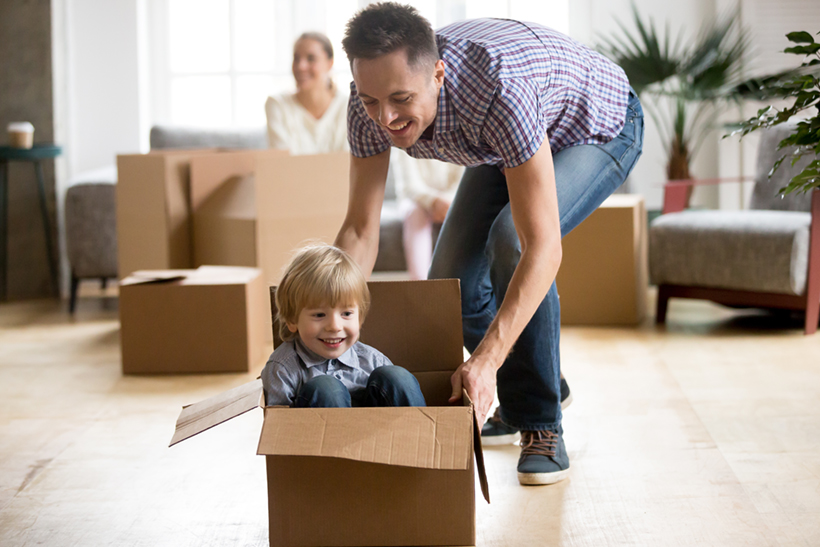 A Happy Kid in the Moving Box