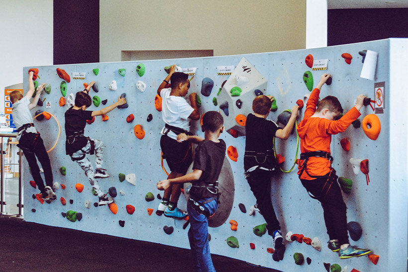 Kids Practicing Free Climbing Indoor