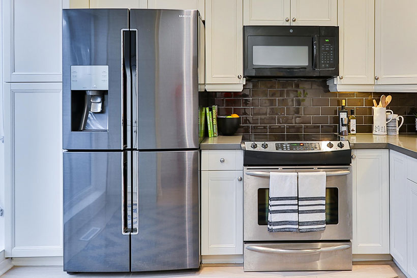 Kitchen with a refrigerator