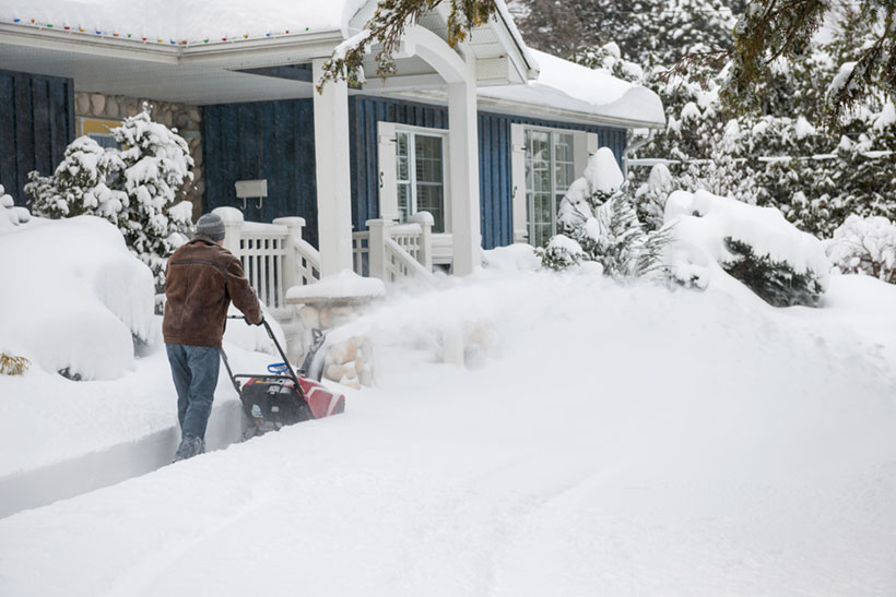 Man Clearing the Snwy Driveway