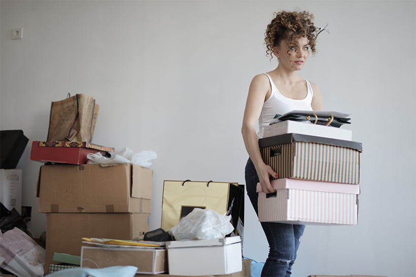 A Woman Packs For Relocation