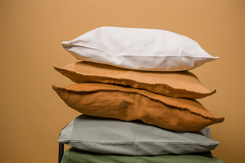 Vertically Stacked Pillows On A Chair