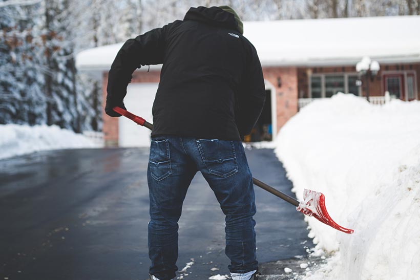 Man Shoveling The Snow