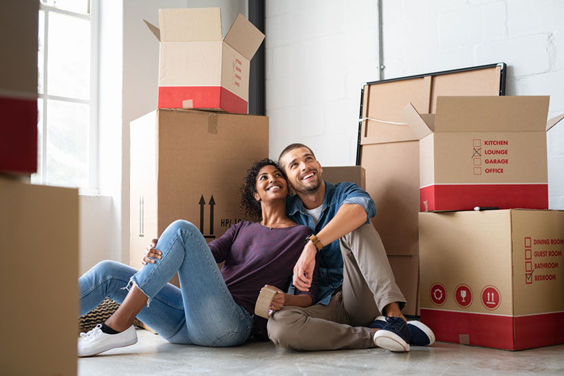 Young Couple Trying to Avoid Unpacking Procrastination