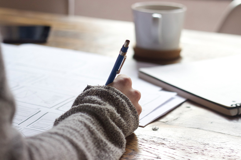 Woman Writing A Letter Of Recommendation